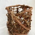 Netted willow bark, interwoven with dandelion cordage, willow bark and a cedar root